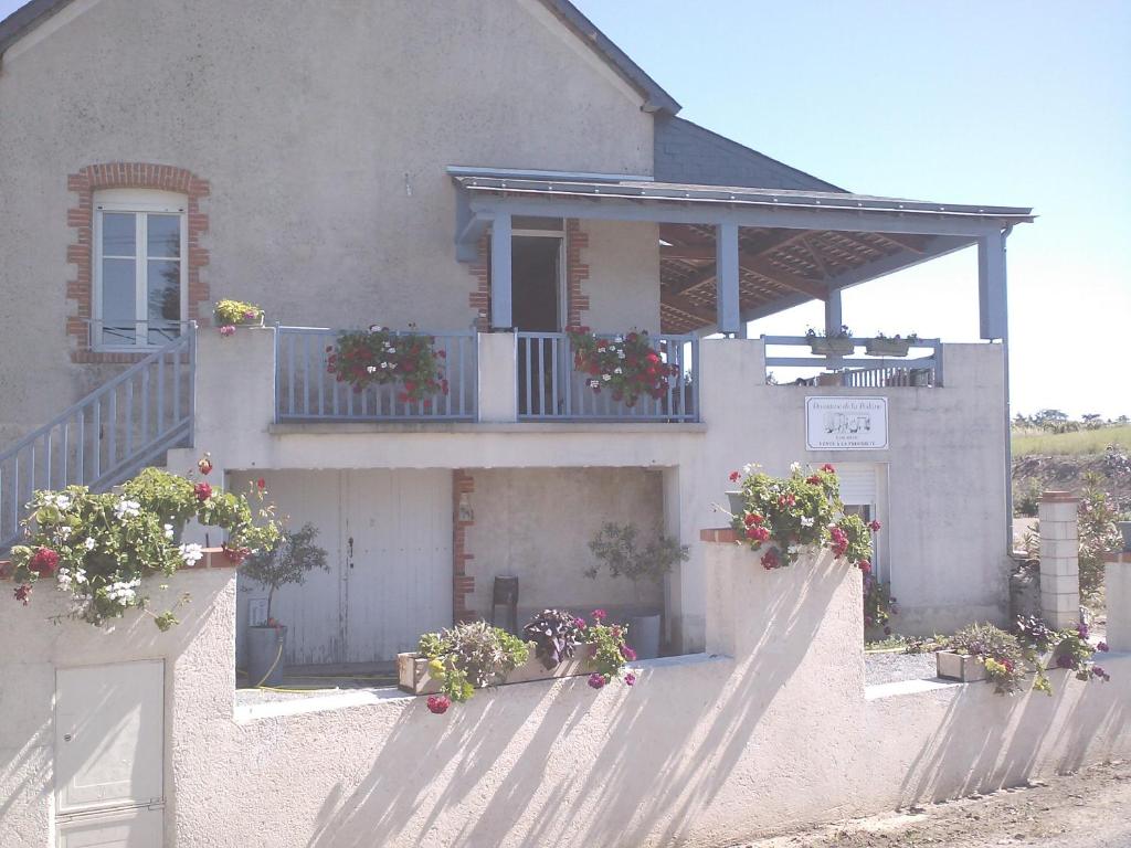 a house with potted plants on the front of it at GITE DE LA POILANE in Saint-Aubin-de-Luigné