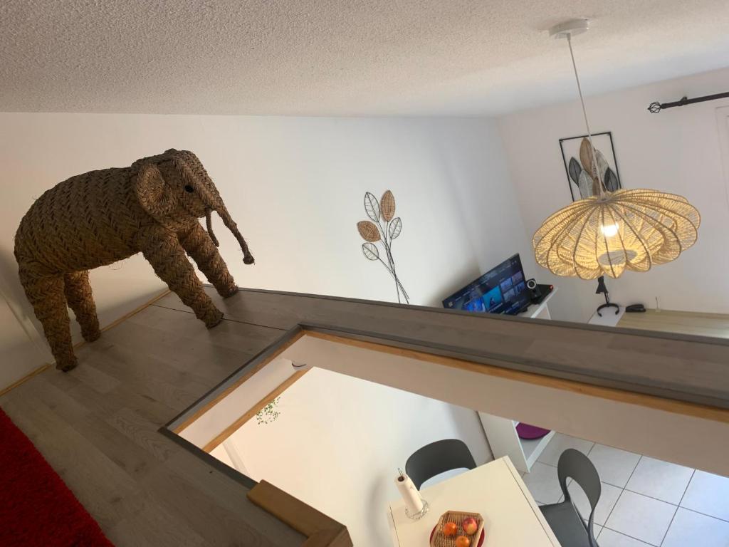 a stuffed elephant standing on top of a counter at Duplex Raphael- Wi-fi et parking privé in Toulon