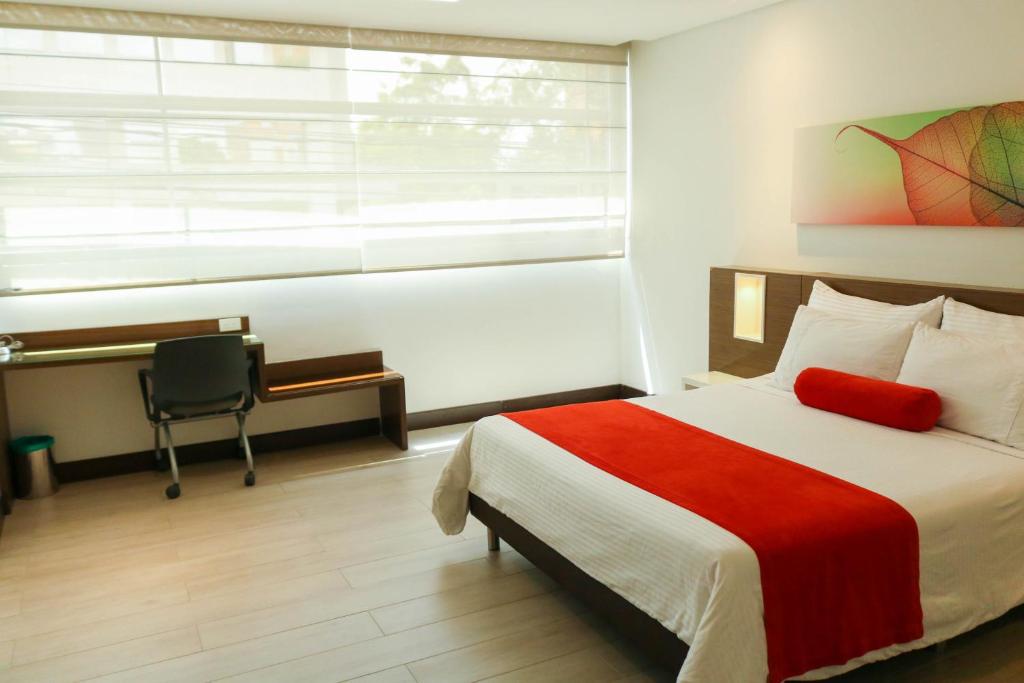 Postel nebo postele na pokoji v ubytování Hotel Loyds