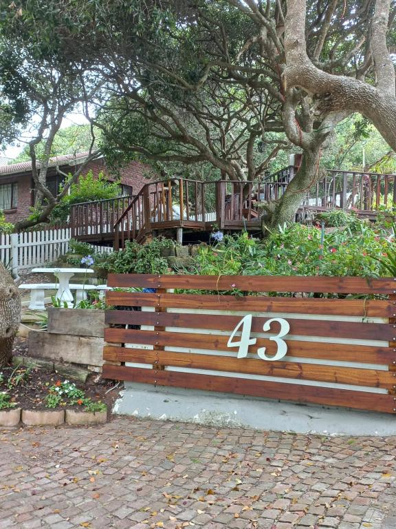 a park bench with the number on it at I Could Live Here - guest house in Sedgefield