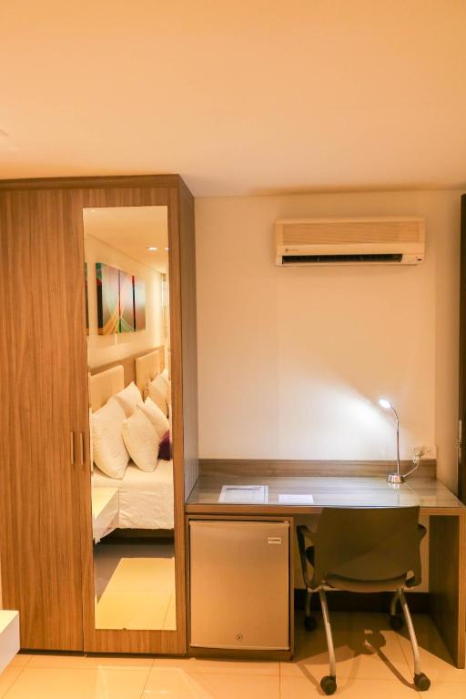 Postel nebo postele na pokoji v ubytování Hotel Loyds