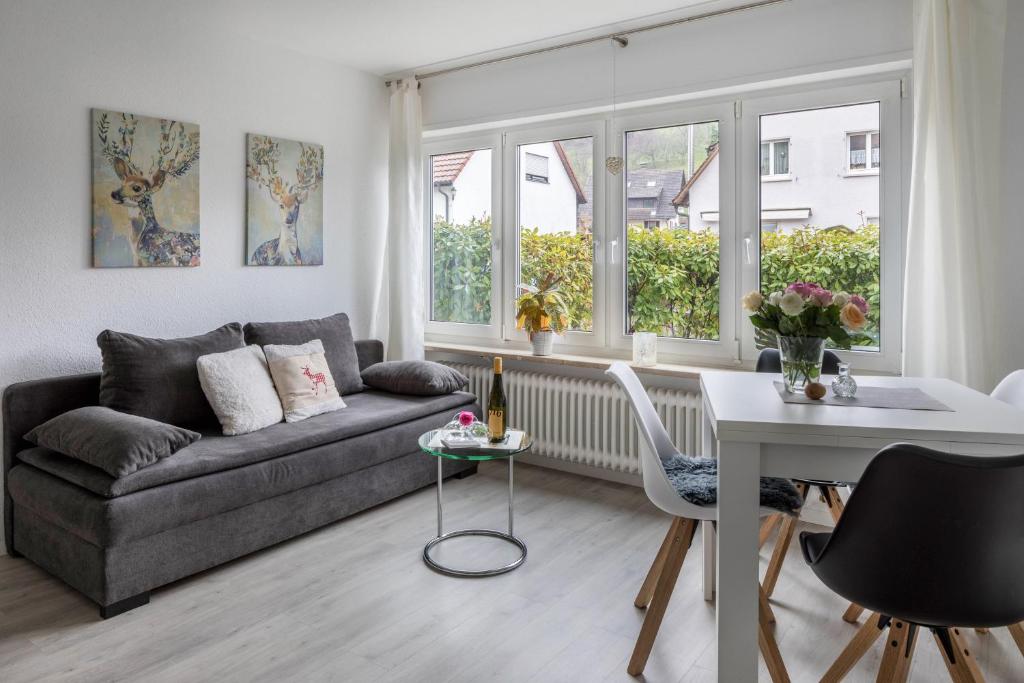 a living room with a couch and a table at Ferienwohnung Holly in Ebringen