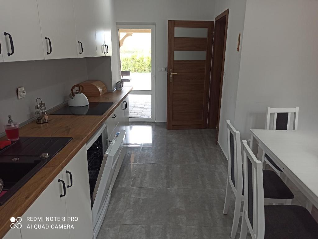Kuchyňa alebo kuchynka v ubytovaní Apartameny Wiktoria i Nikola w Karwiku