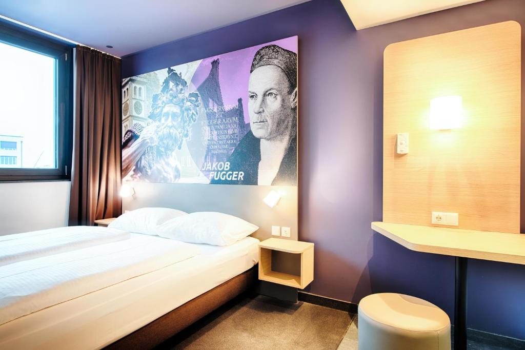 Postel nebo postele na pokoji v ubytování B&B Hotel Augsburg-West