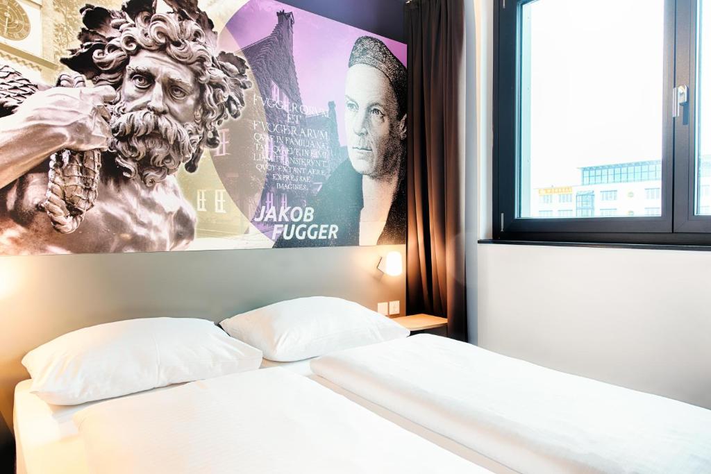 Postel nebo postele na pokoji v ubytování B&B Hotel Augsburg-West