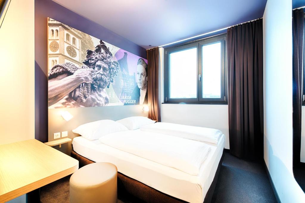 Postel nebo postele na pokoji v ubytování B&B Hotel Augsburg-West