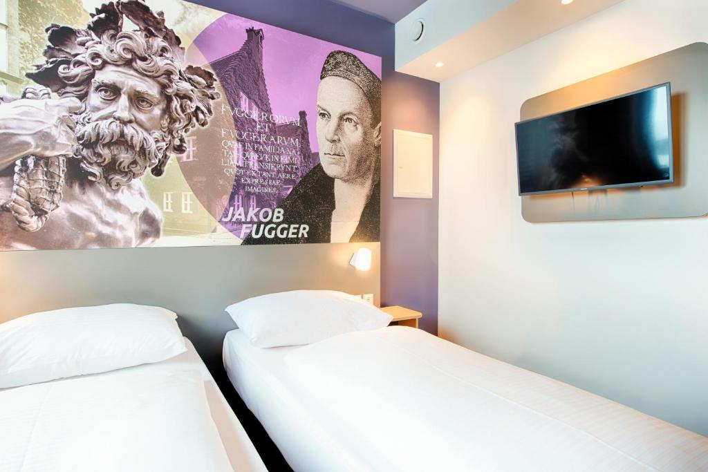 Postel nebo postele na pokoji v ubytování B&B Hotel Augsburg-West