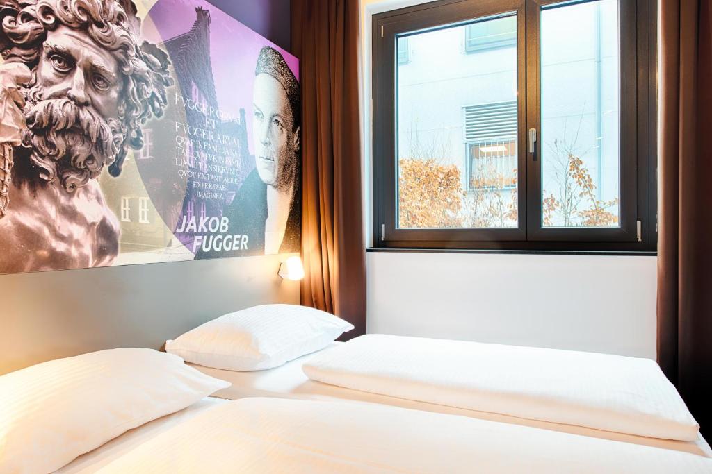 Postel nebo postele na pokoji v ubytování B&B Hotel Augsburg-West