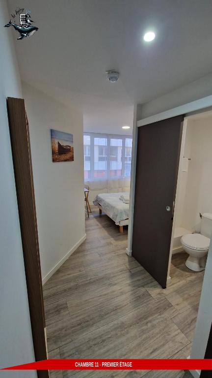 Postel nebo postele na pokoji v ubytování Hôtel Au Valéry