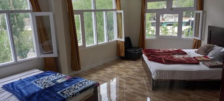 Postel nebo postele na pokoji v ubytování Hotel Saspolo skardu