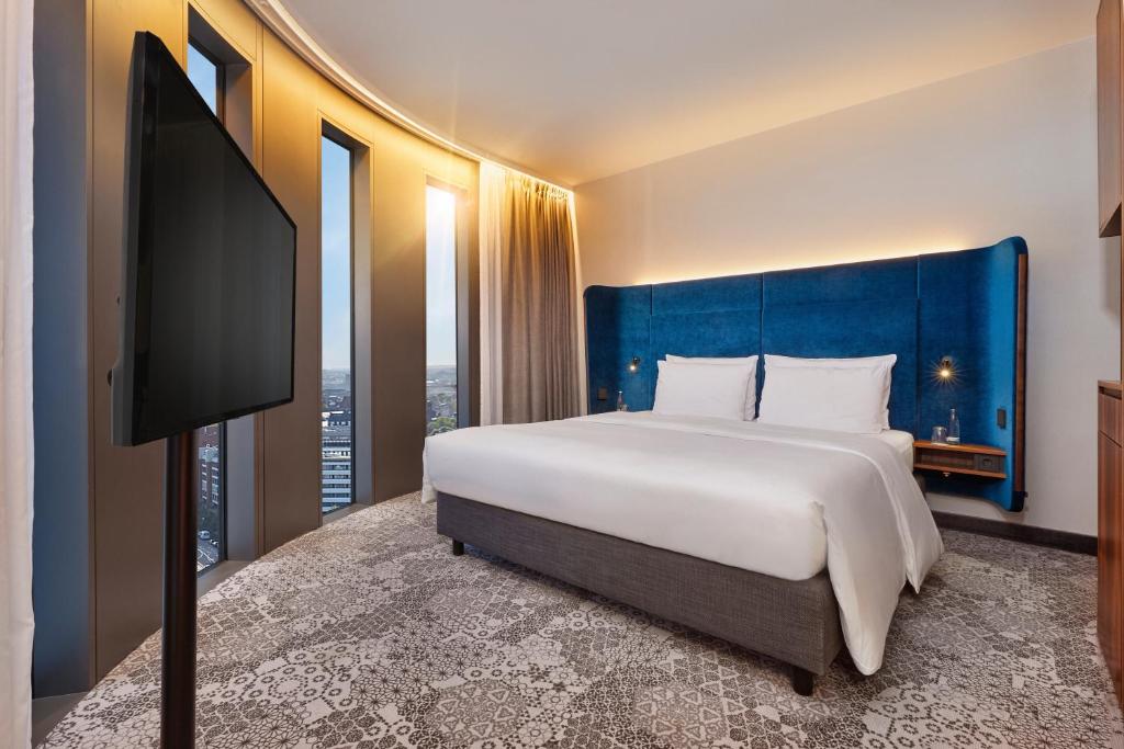 Postel nebo postele na pokoji v ubytování HYPERION Hotel München