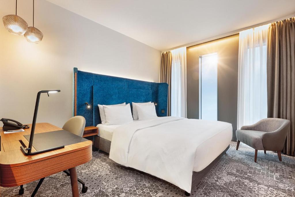 Postel nebo postele na pokoji v ubytování HYPERION Hotel München