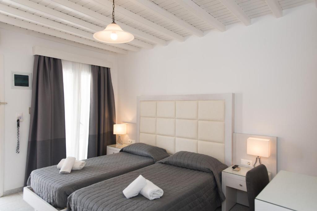Postel nebo postele na pokoji v ubytování Domna Hotel