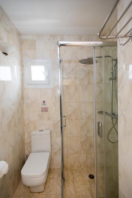 Koupelna v ubytování Domna Hotel