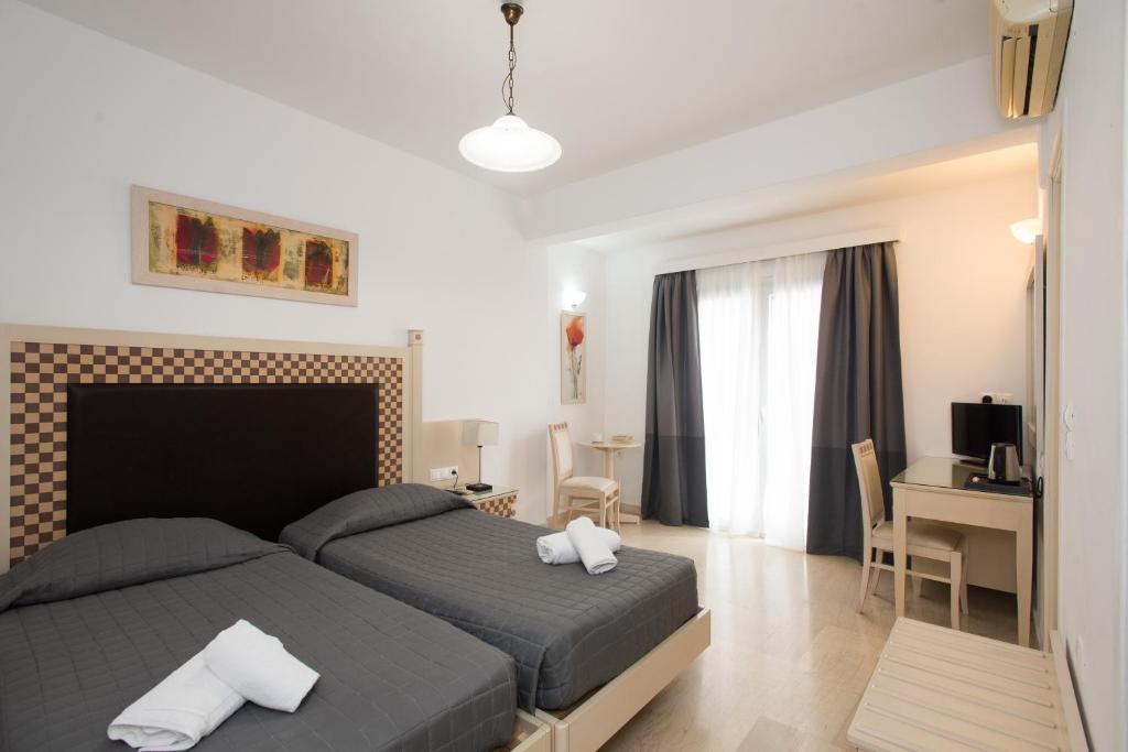 Postel nebo postele na pokoji v ubytování Domna Hotel