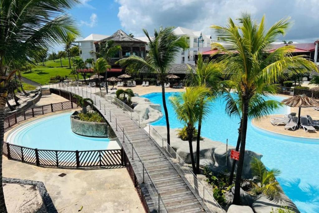 a view of the pool at the resort at Appartement Blue Lagon in Saint-François