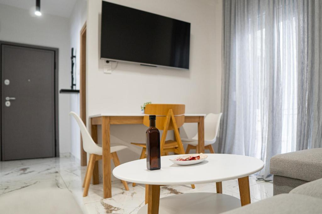 a living room with a wine bottle on a table at Suite Apartment Siatista in Siátista