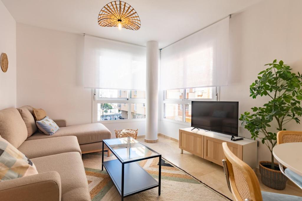 Televízia a/alebo spoločenská miestnosť v ubytovaní Teatro Suites Málaga CITY FLAT