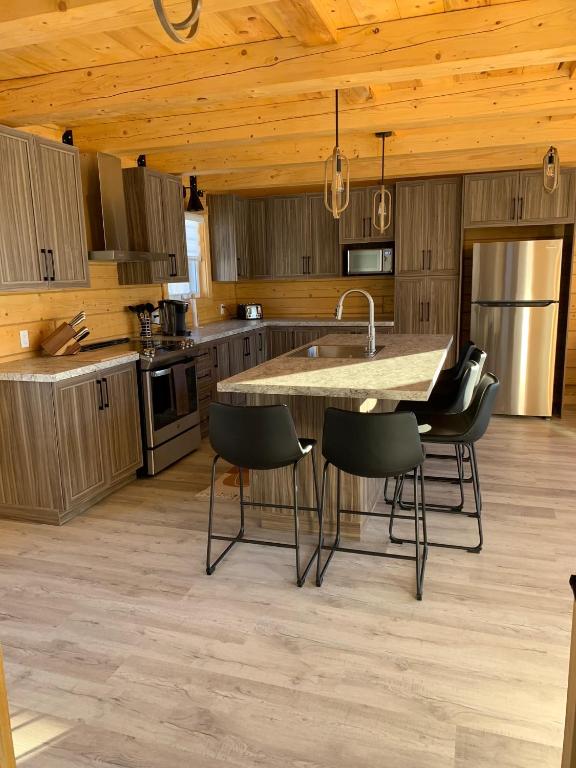 Kuchyň nebo kuchyňský kout v ubytování Chalets domaine Otis