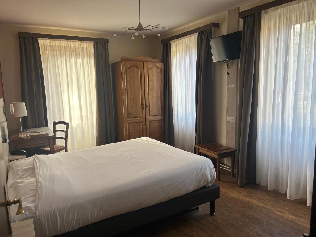 Postel nebo postele na pokoji v ubytování Auberge Des Mésanges