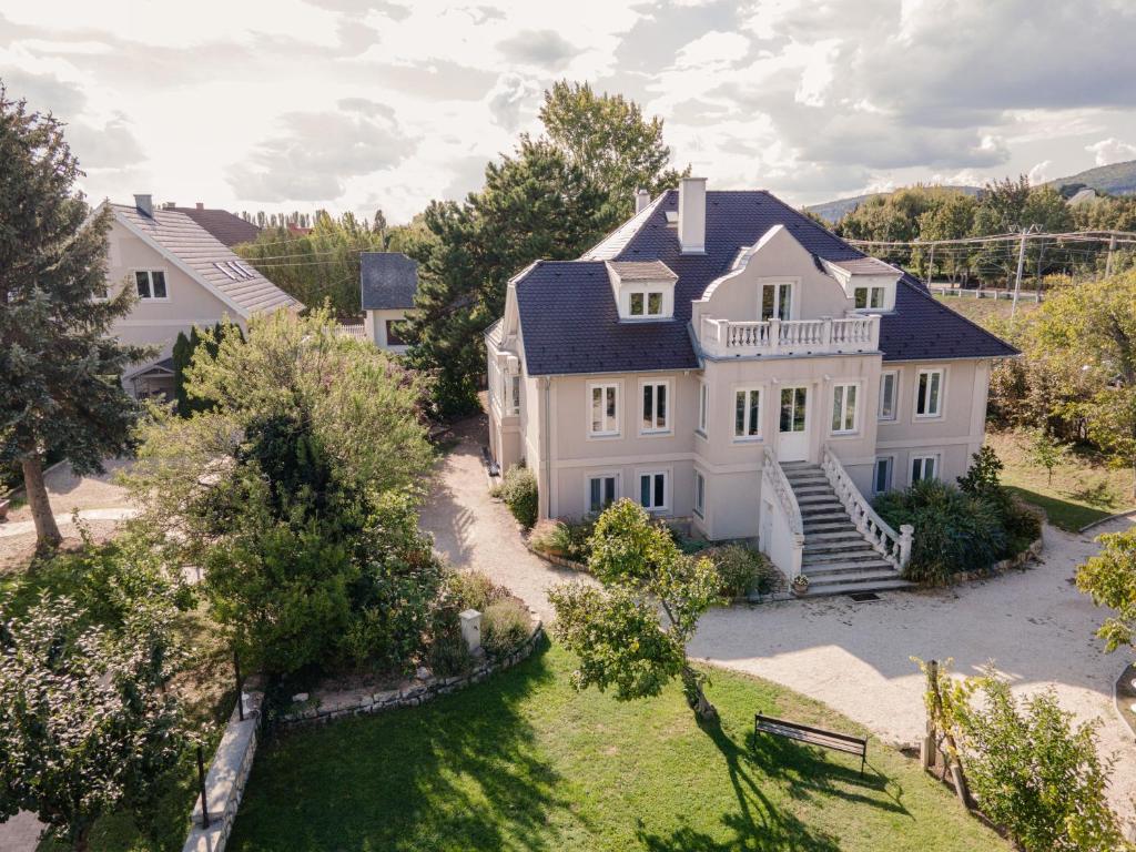 an aerial view of a large white house at Manor House Inn, Csopak in Csopak