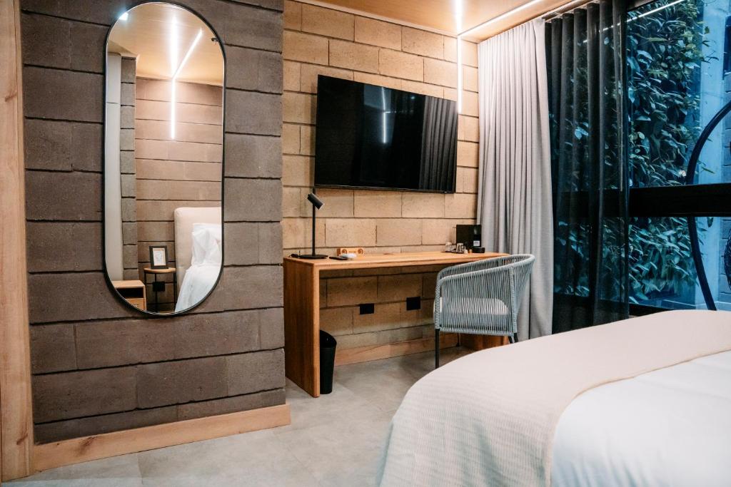 TV a/nebo společenská místnost v ubytování Hotel Living by Armoniko
