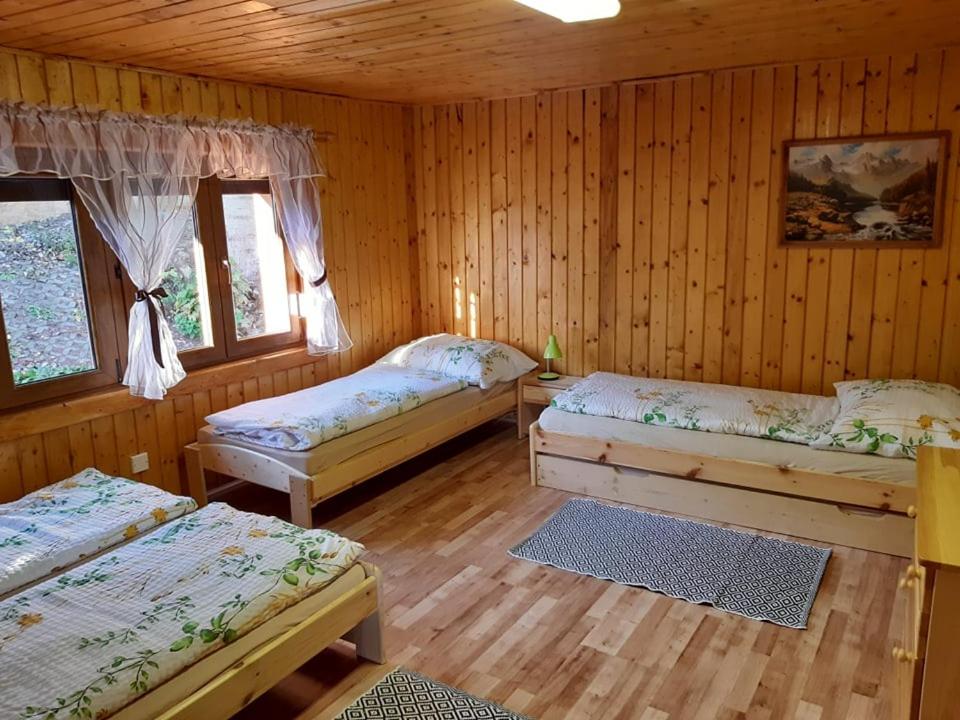 A bed or beds in a room at Chata Klaudia