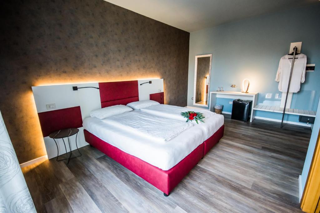 Postel nebo postele na pokoji v ubytování Hotel Eden