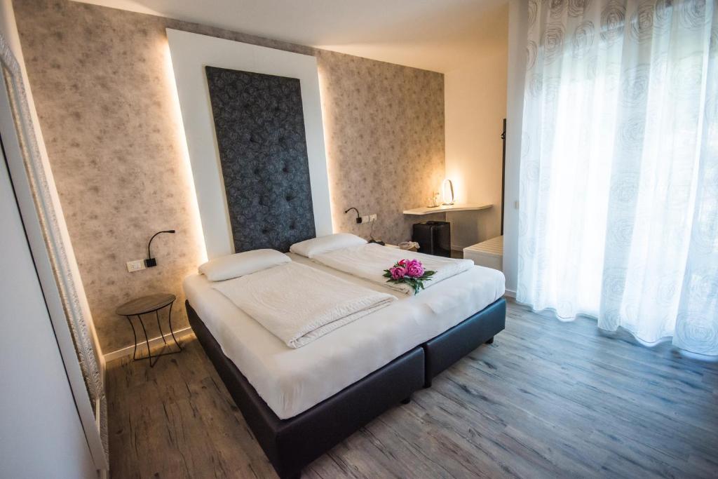 Postel nebo postele na pokoji v ubytování Hotel Eden