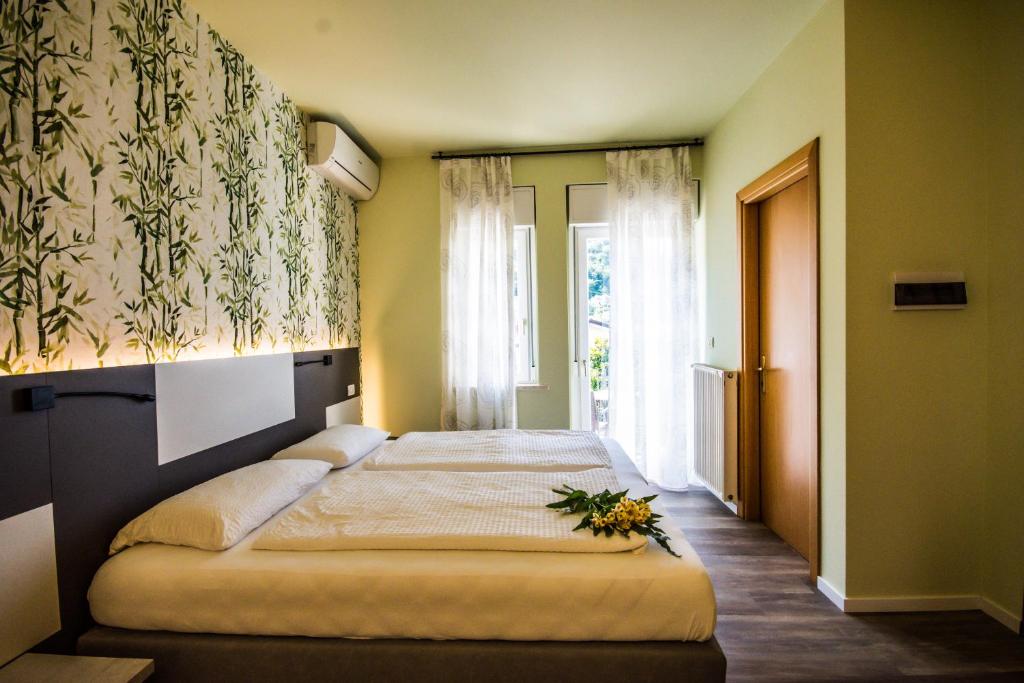 Postel nebo postele na pokoji v ubytování Hotel Eden