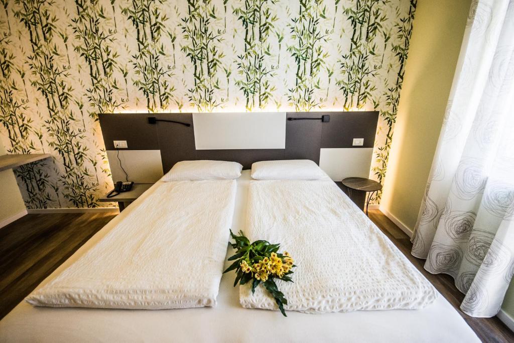 Postel nebo postele na pokoji v ubytování Hotel Eden