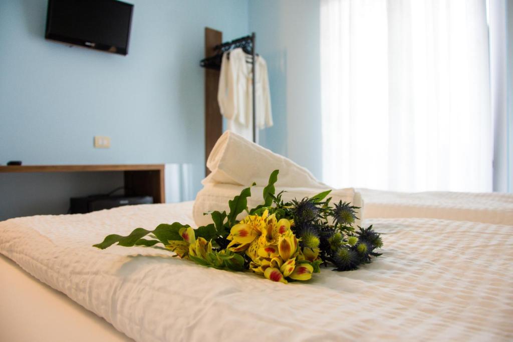 Postel nebo postele na pokoji v ubytování Hotel Eden