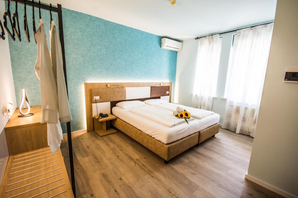 Postel nebo postele na pokoji v ubytování Hotel Eden