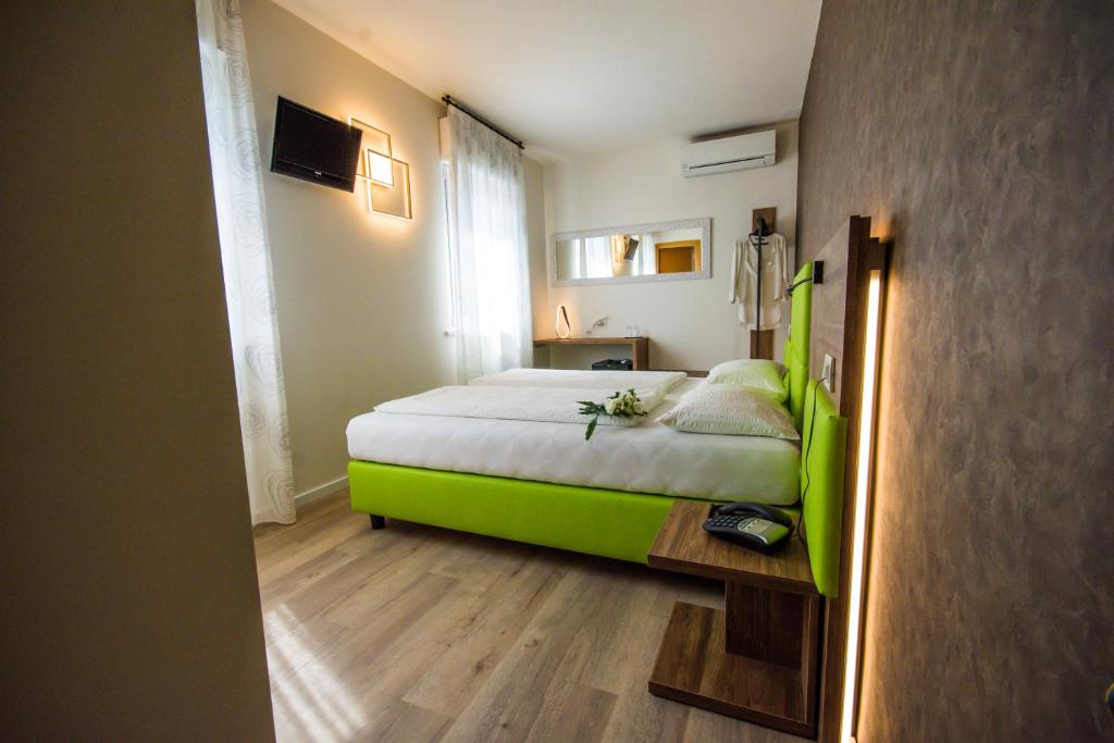 Postel nebo postele na pokoji v ubytování Hotel Eden