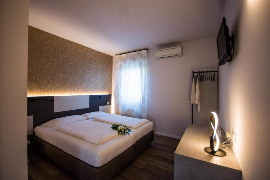 Postel nebo postele na pokoji v ubytování Hotel Eden