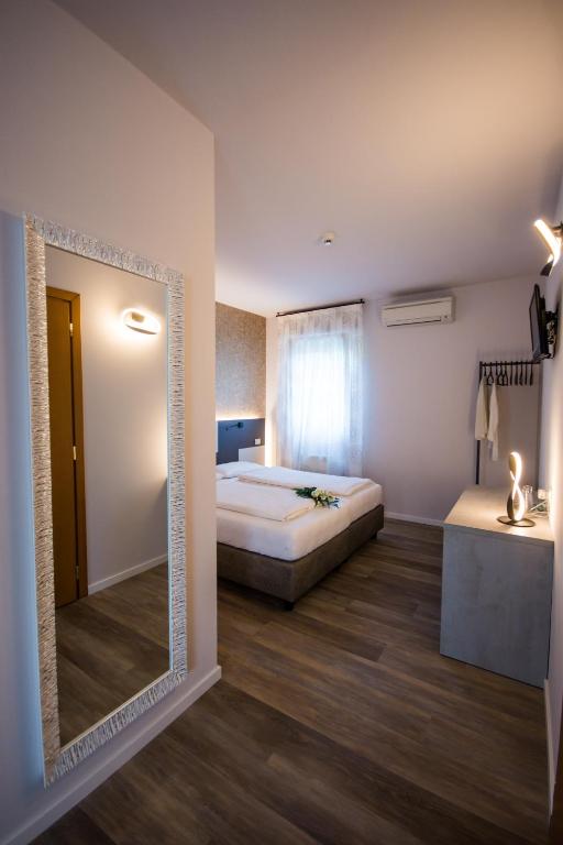 Postel nebo postele na pokoji v ubytování Hotel Eden