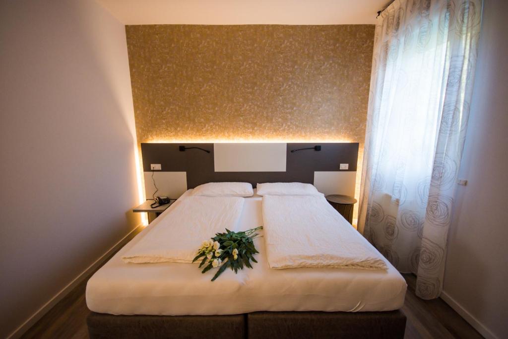 Postel nebo postele na pokoji v ubytování Hotel Eden