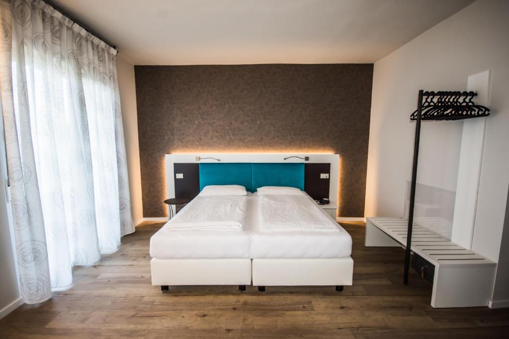 Postel nebo postele na pokoji v ubytování Hotel Eden