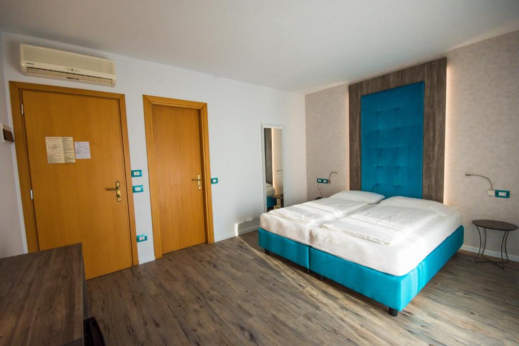 Postel nebo postele na pokoji v ubytování Hotel Eden