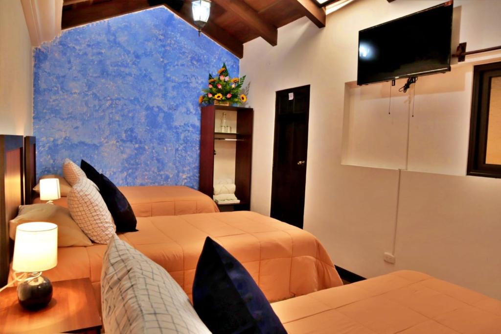 TV a/nebo společenská místnost v ubytování Hotel Posada el Arcangel