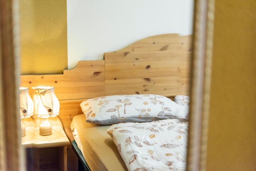 Postel nebo postele na pokoji v ubytování Ciasa Gianot