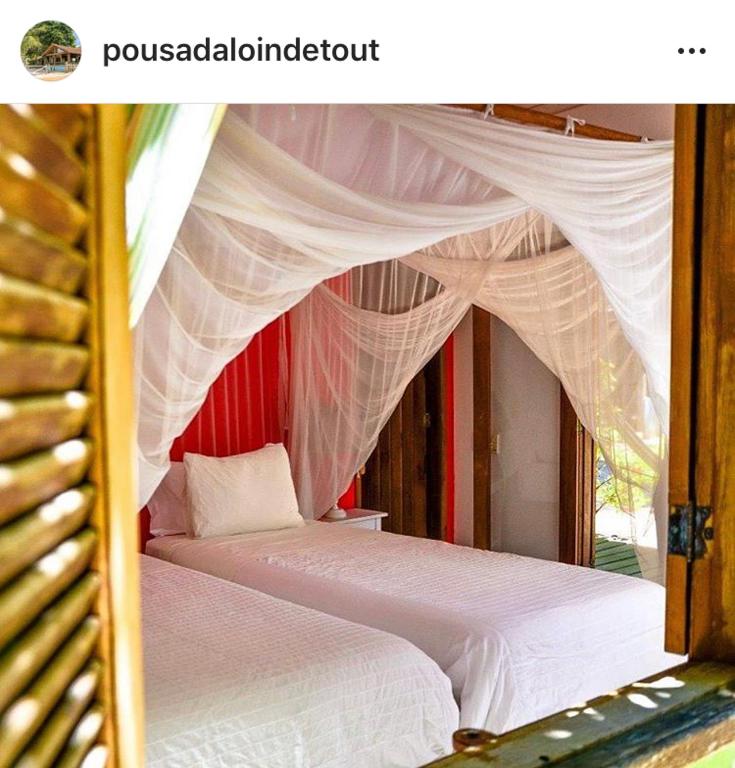Postel nebo postele na pokoji v ubytování Pousada Loin de Tout