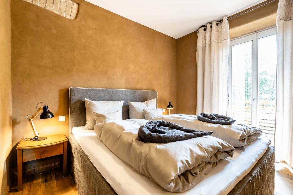 Postel nebo postele na pokoji v ubytování SEINZ Wisdom Resort - Bio-Hotel vegan-vegetarisch