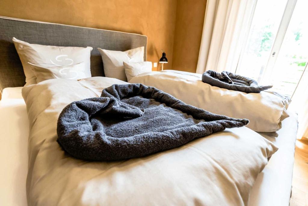 Postel nebo postele na pokoji v ubytování SEINZ Wisdom Resort - Bio-Hotel vegan-vegetarisch