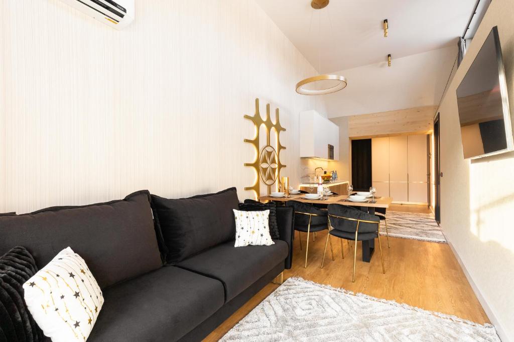 Televízia a/alebo spoločenská miestnosť v ubytovaní Tatry Residence SPA
