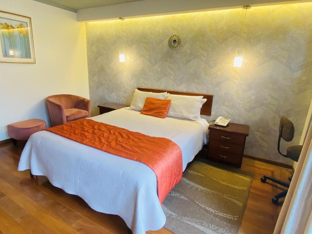 Postel nebo postele na pokoji v ubytování Suites Metropoli