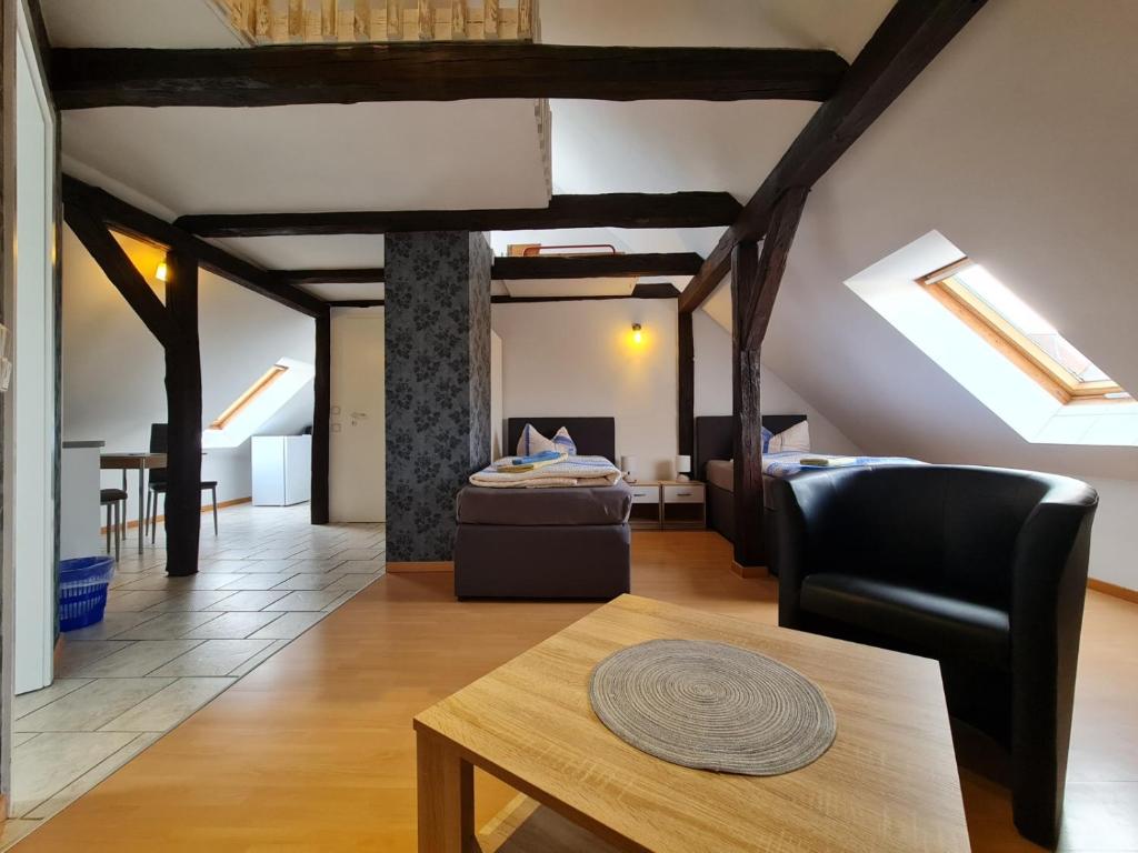 a living room with a couch and a table at Pension Zum Holzwurm Wittenberge in Wittenberge