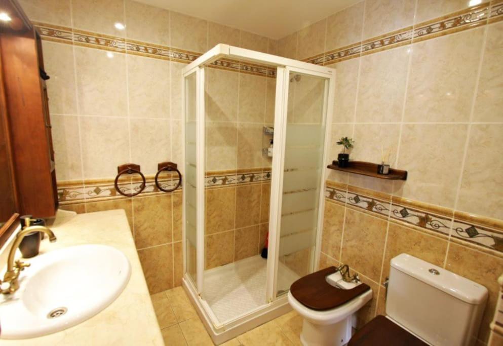 a bathroom with a shower and a toilet and a sink at SB Casa Balcon De Europa, City, Nerja in Nerja