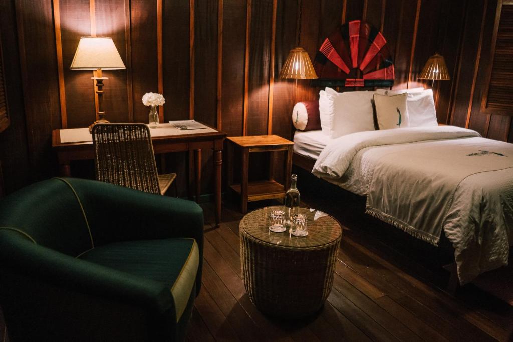 Postel nebo postele na pokoji v ubytování Trogon Lodge