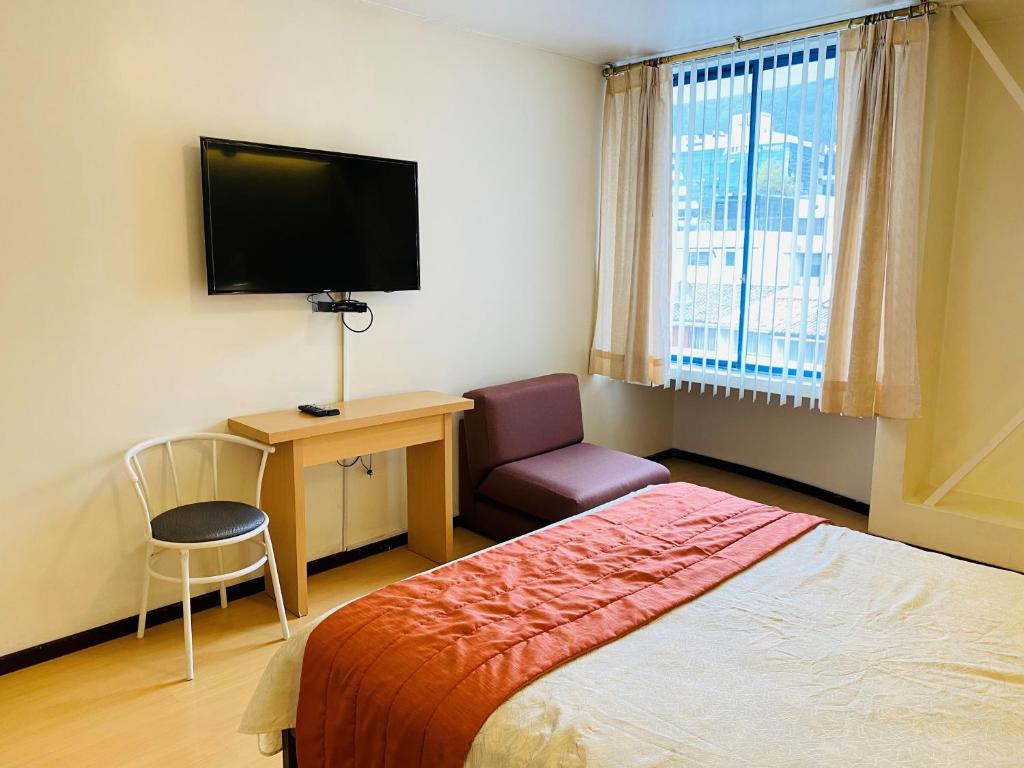 Postel nebo postele na pokoji v ubytování Suites Metropoli